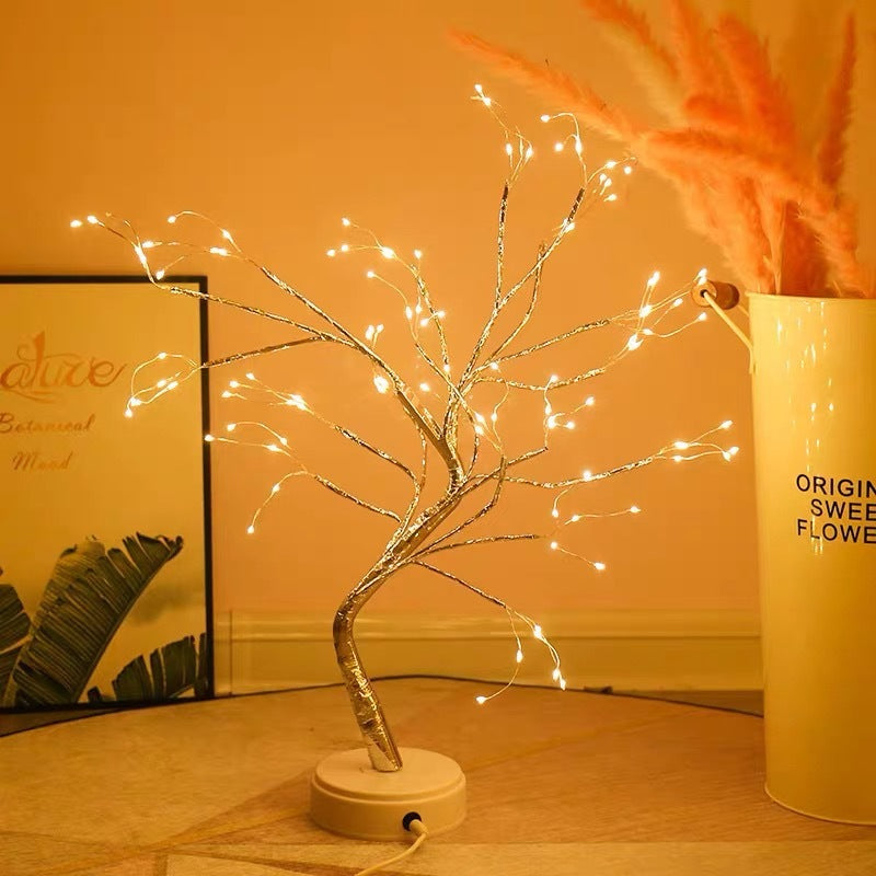 a tree with lights on it with text: 'ORIGIN SWEE FLOWE'