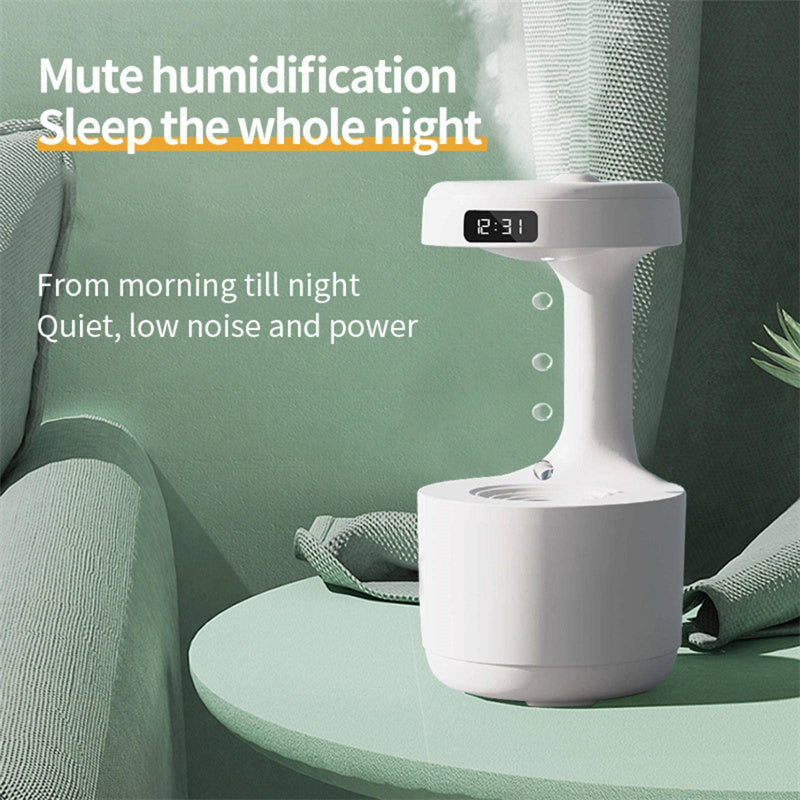 a white device with a clock on a table with text: 'Mute humidification Sleep the whole night From morning till night Quiet, low noise and power'