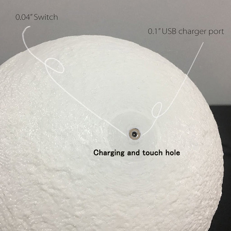 a white ball with a wire attached to it with text: '0.04" Switch 0.1" USB charger port Charging and touch hole'