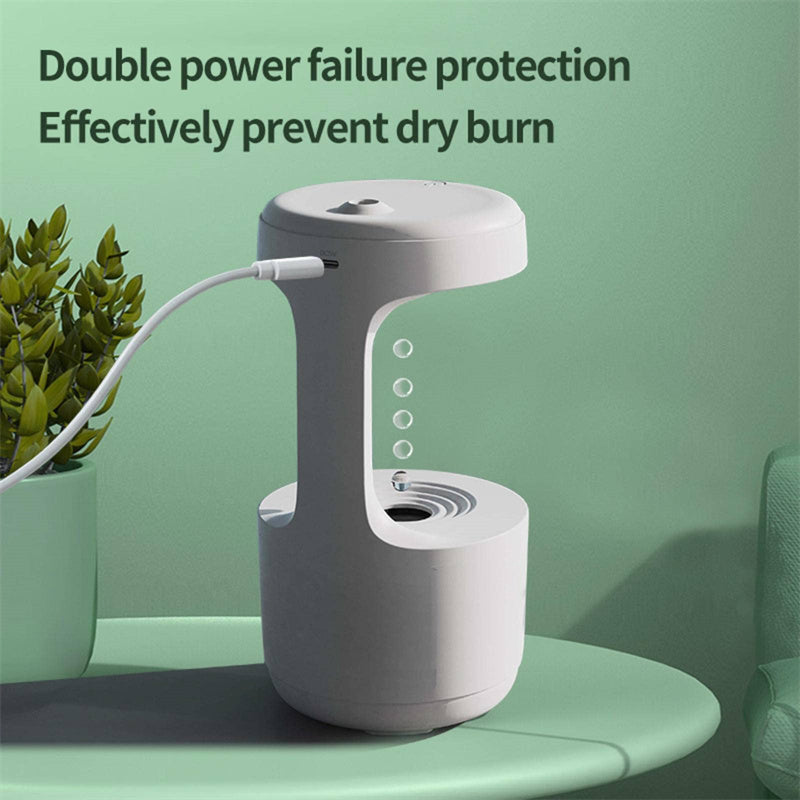 a white device with a cord coming out of it with text: 'Double power failure protection Effectively prevent dry burn'