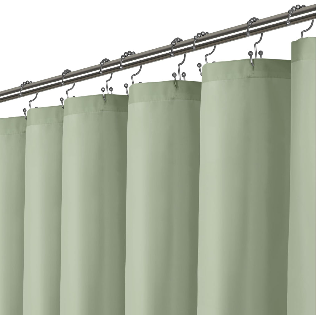 a curtain rod with green curtains